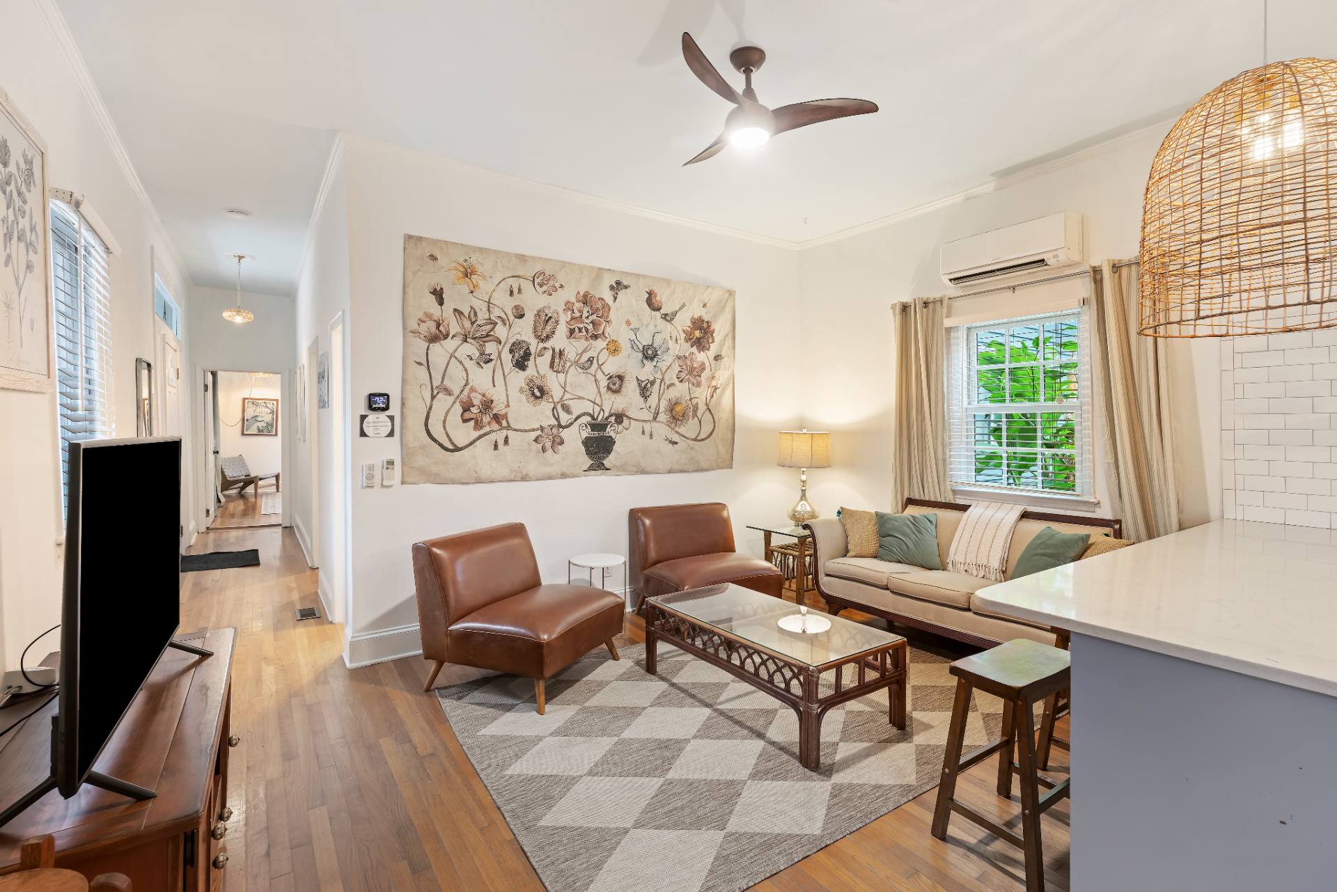 Suite A living room with botanical tapestry