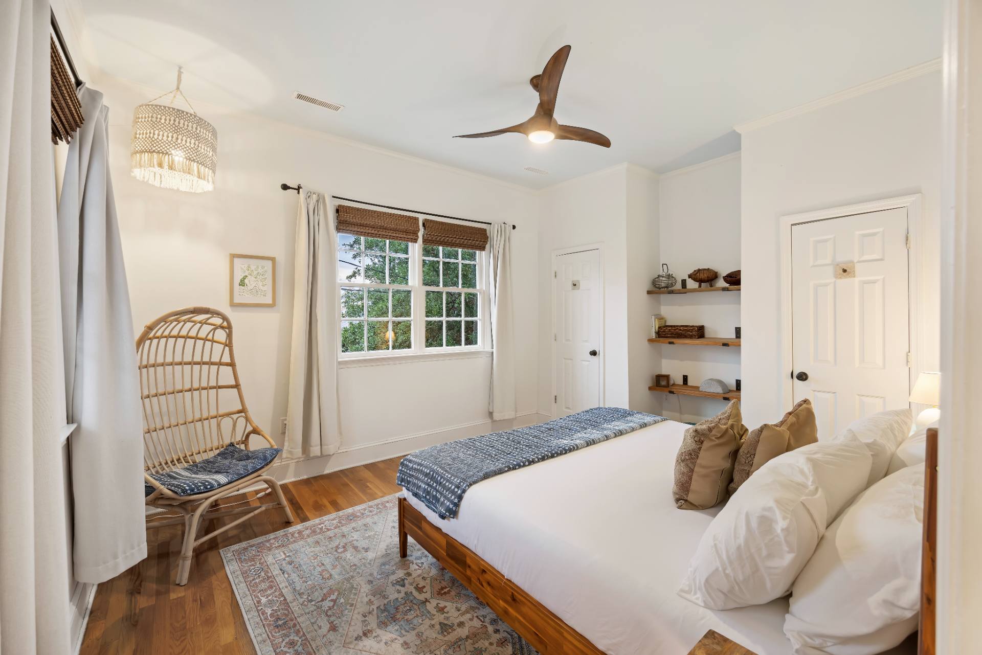 Suite B queen bedroom with rattan hanging chair