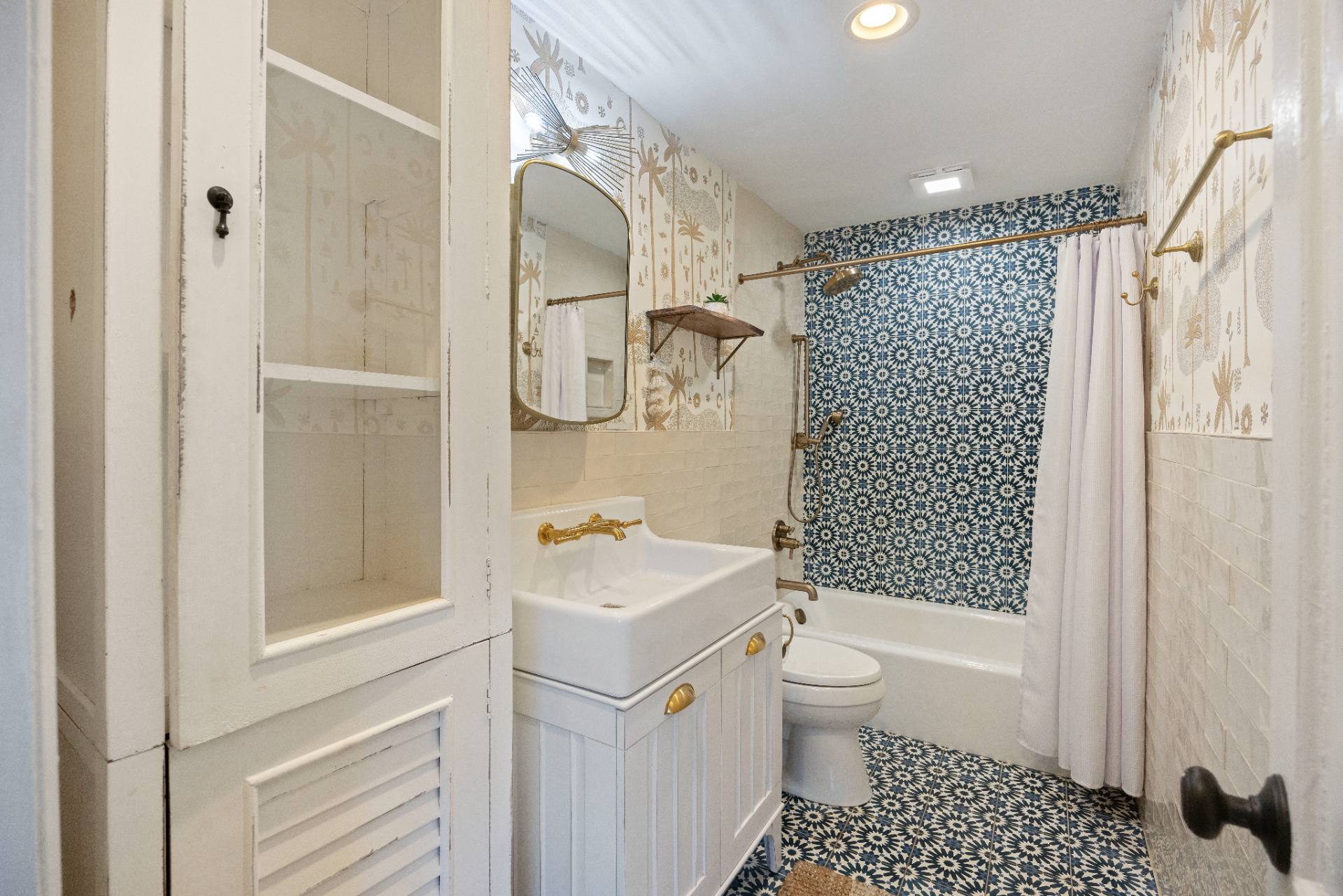 Suite A bathroom with Moroccan tile and brass