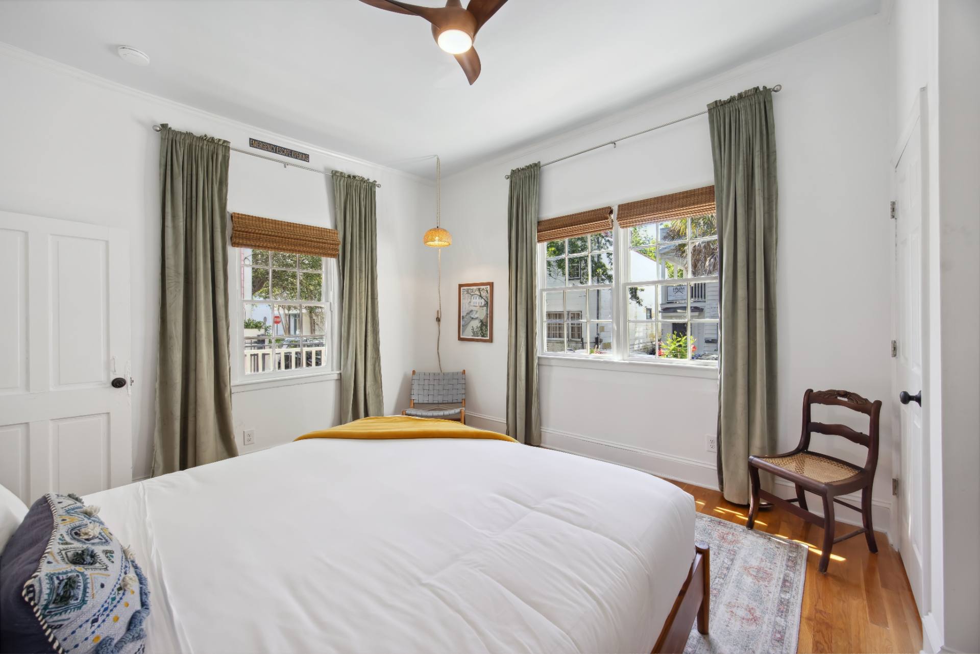 Suite A king bedroom with velvet curtains